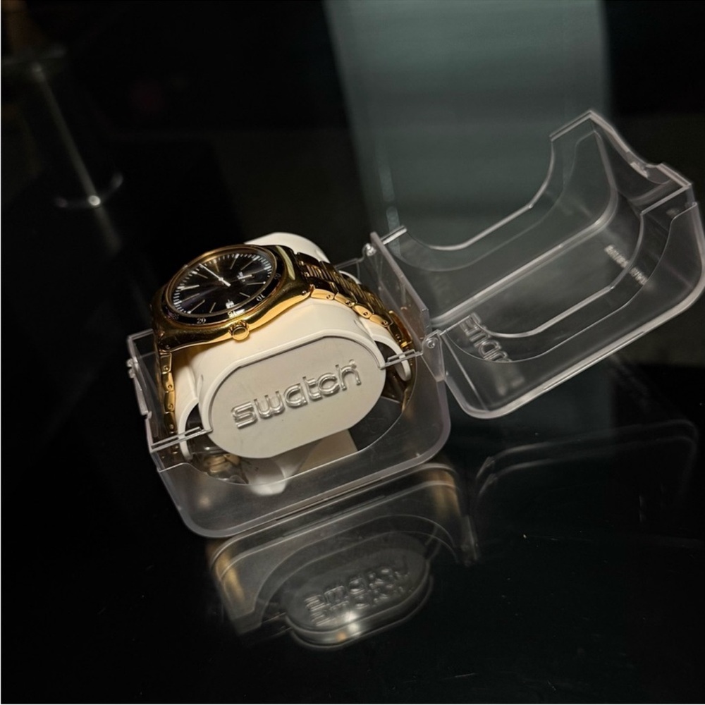 Swatch men’s bullet gold tone watch